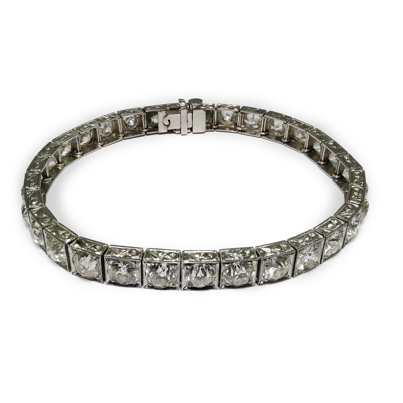 A platinum and thirty one stone round cut diamond set line bracelet